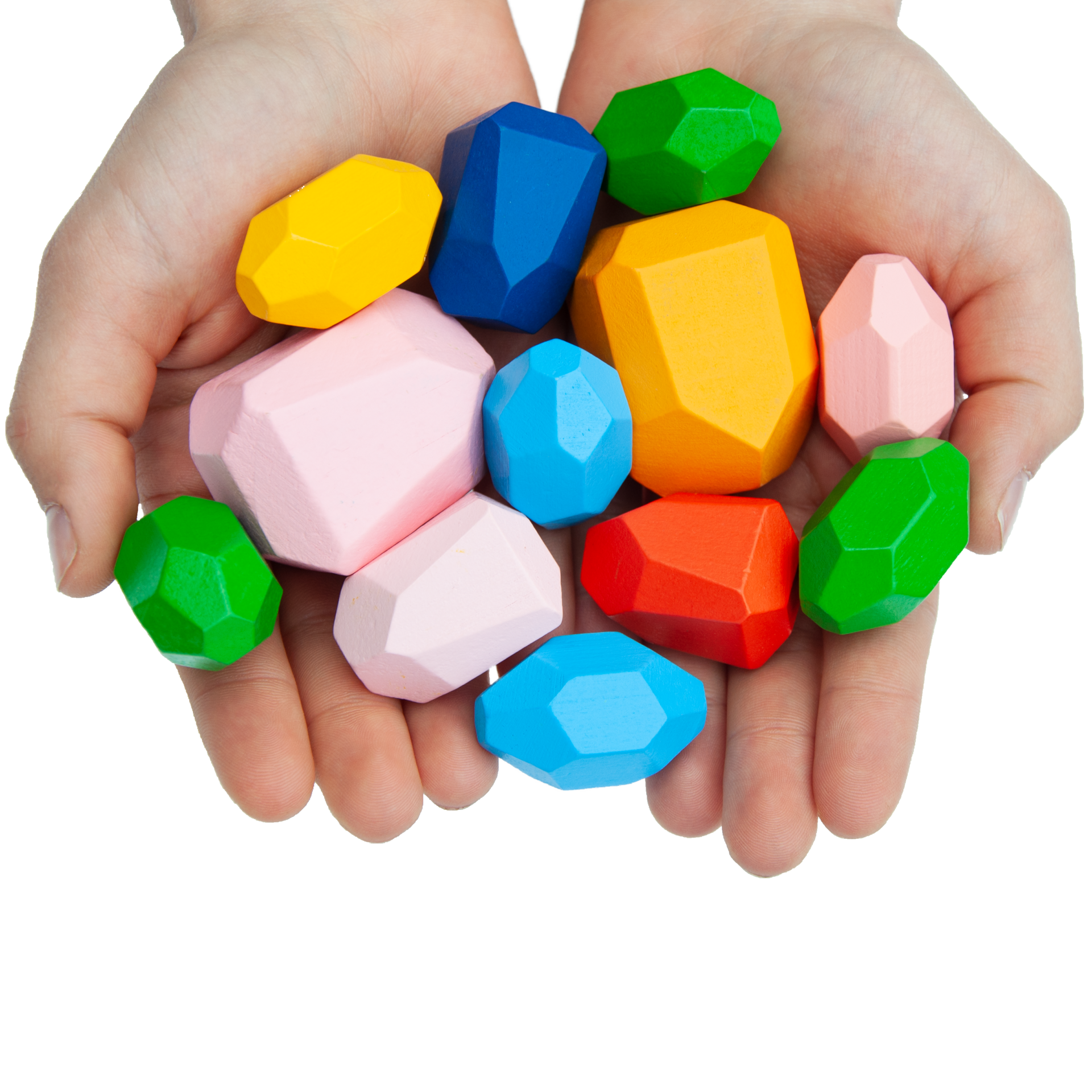 Kinderhände spielen mit Stapelsteinen